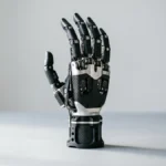 Multi-articulating myoelectric bionic prosthetic hand on a studio surface